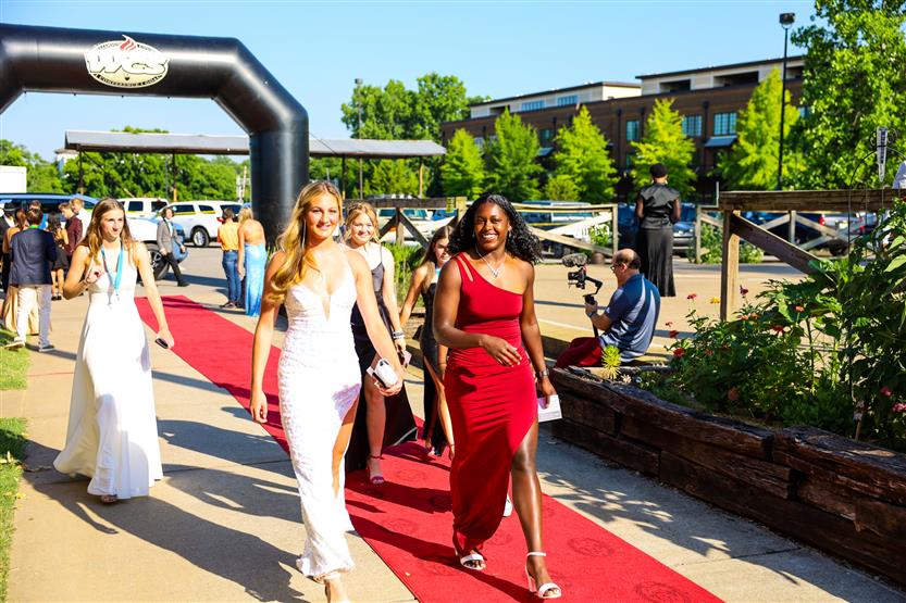 Students walk down the red carpet at an awards show
